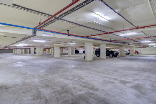 an empty parking garage with cars parked in it at Sea View with Balcony in Dabolim