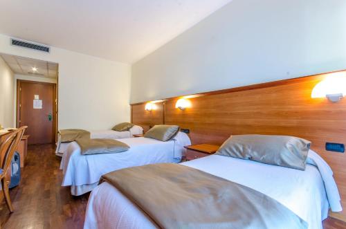 Postel nebo postele na pokoji v ubytování Hotel Federico II