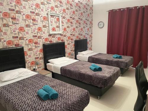 Katil atau katil-katil dalam bilik di Kebu Rentals