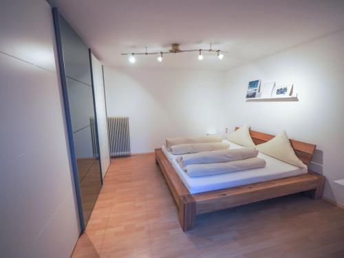 a bedroom with a bed and a mirror at Hotel - Restaurant - Metzgerei Sonne in Loffenau