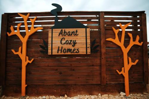 an exhibit of a wooden fence with a sign that reads about coy homes at Abant Cozy Homes in Bolu