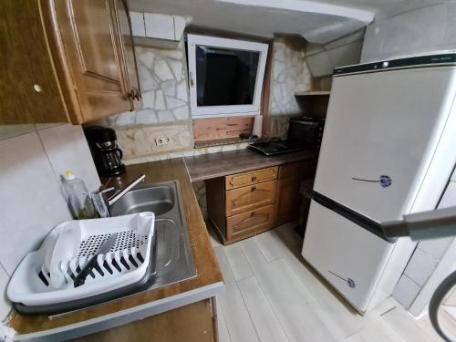 a small kitchen with a sink and a refrigerator at Ramstein in Ramstein-Miesenbach