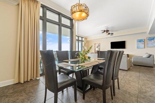 a dining room with a table and chairs at The Oasis at Orange Beach 2006 (Phoenix West II) in Orange Beach