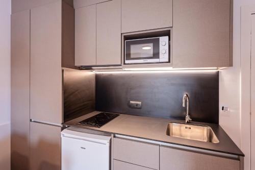 Кухня или мини-кухня в Hotel La Perla D'Olot
