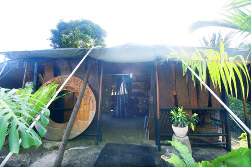 a wooden house with a large wooden barrel at rockwood vila in Kandy