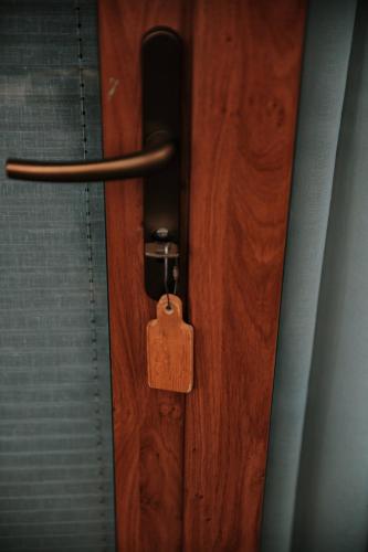 a wooden door with a tag on it at Abant Cozy Homes in Bolu