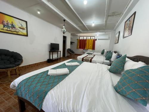 En eller flere senger på et rom på Villa Apolonia Resort