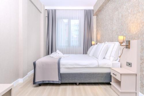Cama o camas de una habitación en Olea Suites Otel