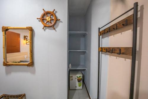 a bedroom with a bunk bed and a mirror at Dive Villa Thoddoo in Thoddoo