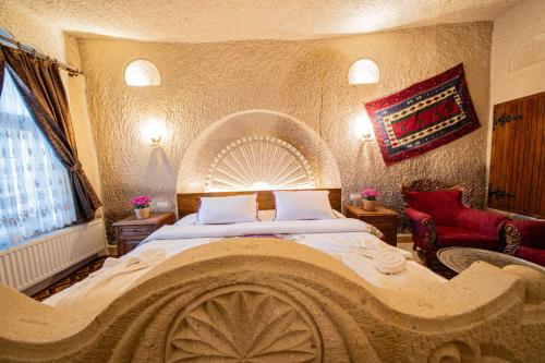 Un ou plusieurs lits dans un hébergement de l'établissement Safran Cave Hotel