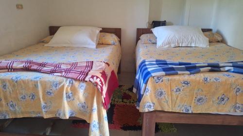 Ein Bett oder Betten in einem Zimmer der Unterkunft Finca Campestre Villa Gladys