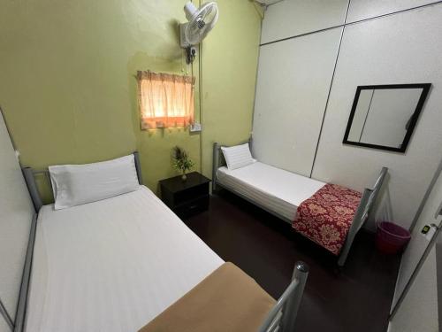 Postel nebo postele na pokoji v ubytování De Cameron Guest House