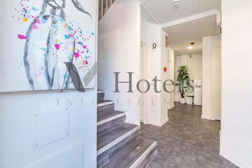 a hallway with a hotelier sign on the wall at AYZ Ulises - Auto check-in property in Madrid