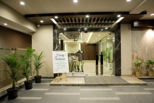 a lobby with a sign in front of a store at Maruti Group of Hotels - The Shivam in Nāthdwāra