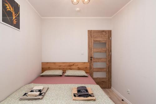 a room with two beds and a ladder at ApartWro 8th - City Square, Railway Station (balcony, garage) in Wrocław