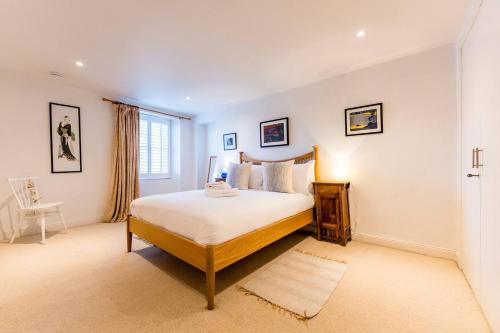 a bedroom with a large bed and a window at Pass the Keys The Lofthouse St Monans in Anstruther