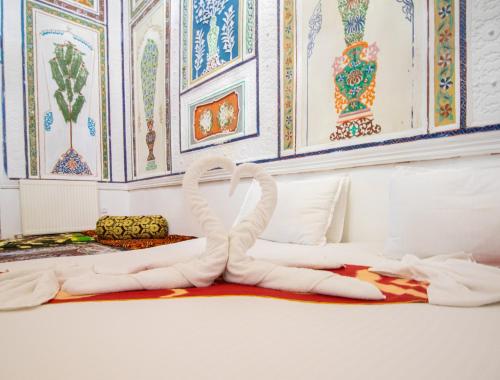 Ένα ή περισσότερα κρεβάτια σε δωμάτιο στο Hotel Zaringiz