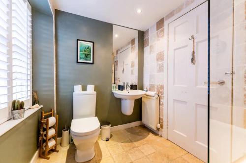 a bathroom with a toilet and a sink at Pass the Keys The Lofthouse St Monans in Anstruther
