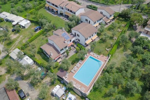 an overhead view of a house with a swimming pool at Hotel Alesi in Malcesine