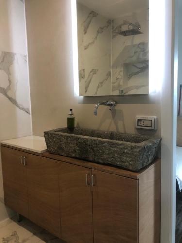 a bathroom with a sink with a faucet at Agriturismo Voeuja Lago Maggiore in Luino