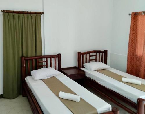 Postel nebo postele na pokoji v ubytování CHIISAI NATSU RESORT