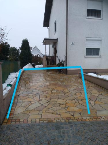 a pool with a blue pole on a patio at Ferienwohnung Josef in Steyr