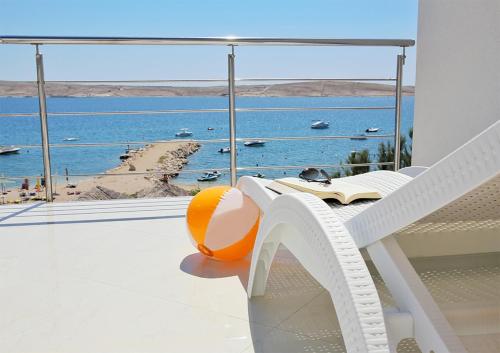 a balcony with a view of the ocean at Apartments Barbati in Novalja