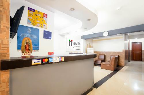 a lobby of a hospital with a reception counter at Hotel Italia I in Chiclayo