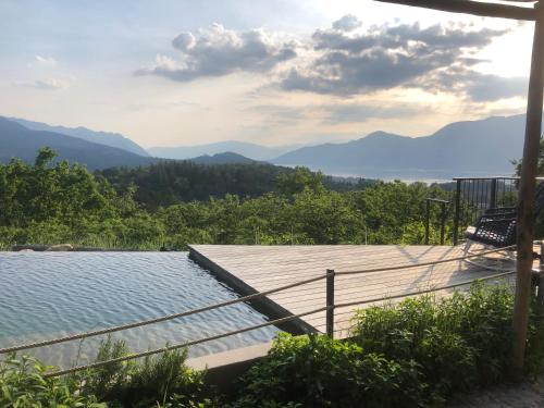 a view of the mountains from the deck of a house at Agriturismo Voeuja Lago Maggiore in Luino