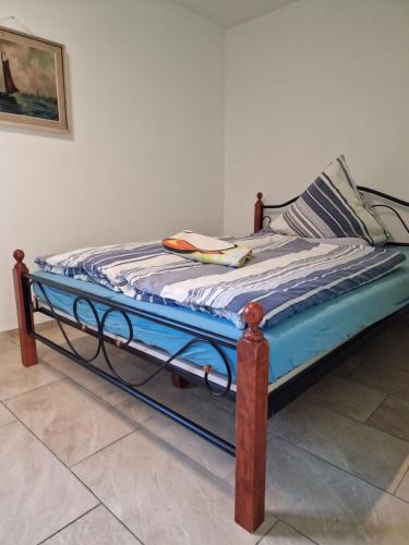 a bed sitting in a room with at Ferienhaus in Burgenlandkreis (Osterfeld) in Osterfeld