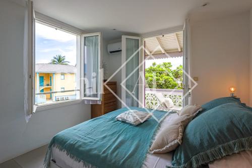 Kama o mga kama sa kuwarto sa Beautiful 2 bed-rooms apartment at Orient Beach