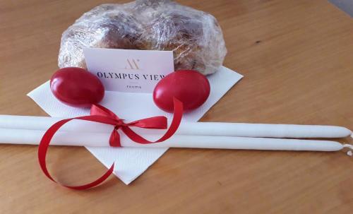 a bunch of cinnamon sticks and cherries on a table at Olympus View Rooms Sauna & Spa in Litochoro