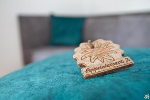 a small cookie sitting on top of a green table at Apart Prieth Samnaun in Samnaun