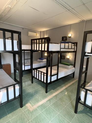 a group of bunk beds in a room at Revolution Pai In Town in Pai