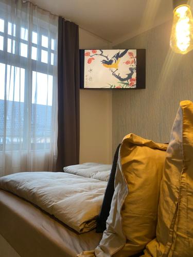 Ένα ή περισσότερα κρεβάτια σε δωμάτιο στο H-36 RESIDENCE 1.2