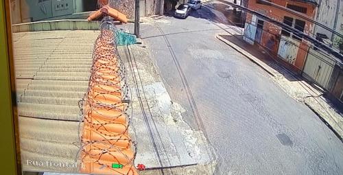 a fire hydrant on the side of a street at CASA DE FÉRIAS BH in Belo Horizonte
