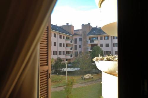 a view of a building from a window at Orea Spiti - Modern Oasis Near Milan in Assago