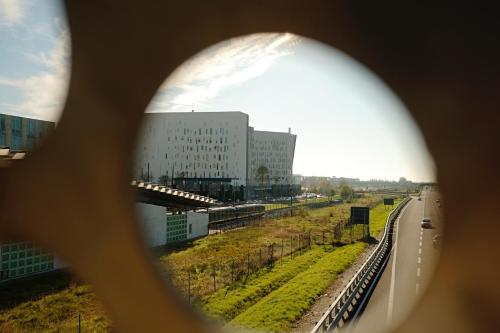 a view of a building through a magnifying glass at Orea Spiti - Modern Oasis Near Milan in Assago