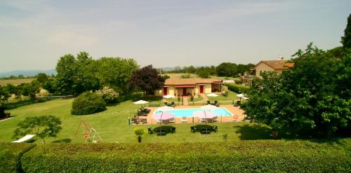 an aerial view of a backyard with a pool and a house at Oasi di Agilla in Panicarola