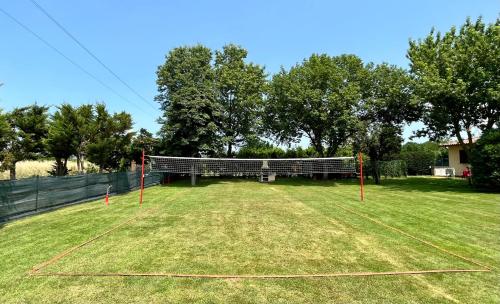 a large field with a net in the grass at Oasi di Agilla in Panicarola