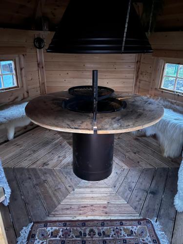 a sauna with a round table in a cabin at Wellness Oase auf dem Land in Buttstädt