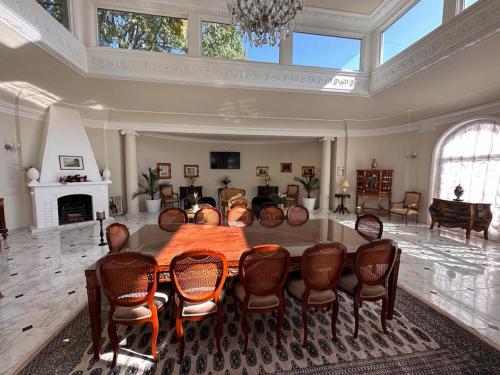 a large living room with a large table and chairs at Wienerwald Residenz in Baden