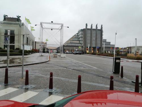 an empty parking lot with cars parked on the street at nys willy in Grimbergen