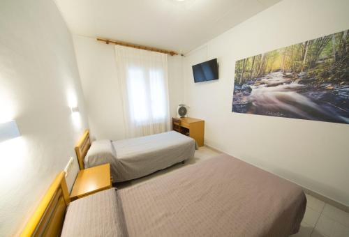 Postel nebo postele na pokoji v ubytování Turó de L´Home