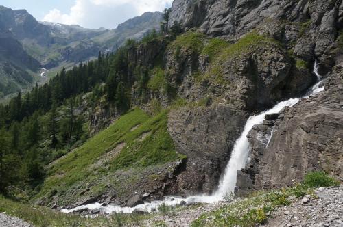 a waterfall on the side of a mountain at bnb Valais - by La Sittelle in Grimisuat