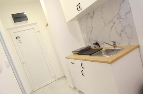 Kuchyň nebo kuchyňský kout v ubytování Residence Spa Apartments DUB
