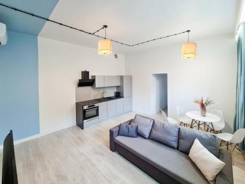 a living room with a couch and a table at Apartment Quiet Street 11, 3E in Oświęcim