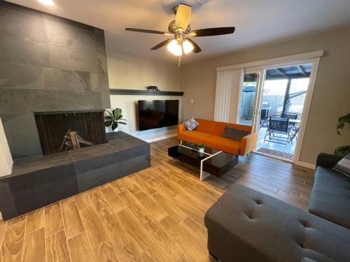 a living room with a couch and a fireplace at New Midtown Modern Home with Backyard (Unit A) in Phoenix