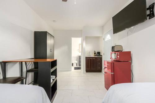 a kitchen with a red refrigerator and a table at Your Downtown Studio With All Amenities Unit B in Phoenix