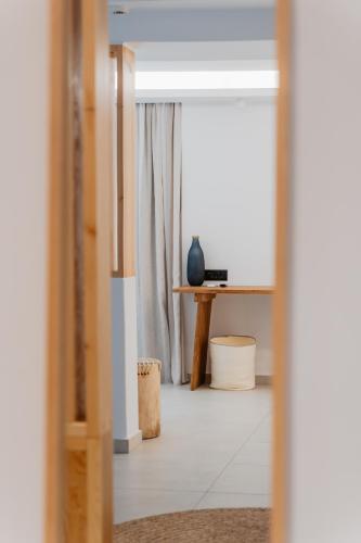 a view of a room with a table and a window at Oliving Mykonos Luxury Suites in Klouvas
